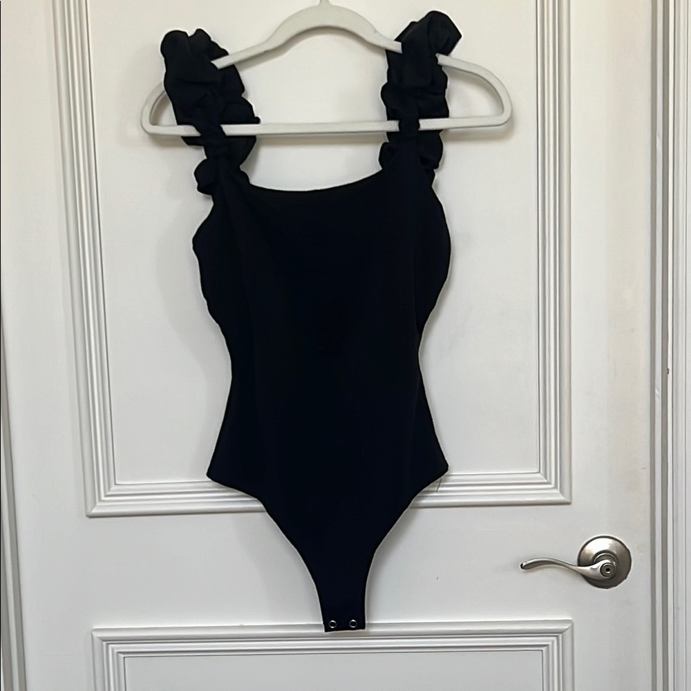 NWT ENTRO black ruffle body suit. Size Small